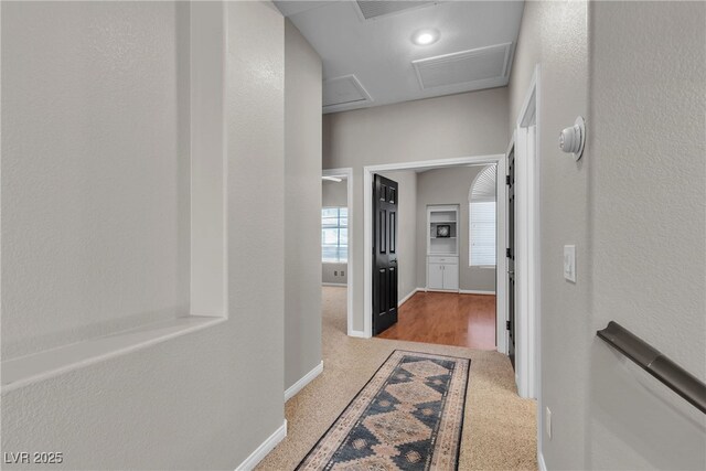 3047 Whispering Crest Dr, Henderson, NV 89052 - hall with carpet flooring, baseboards, and attic access