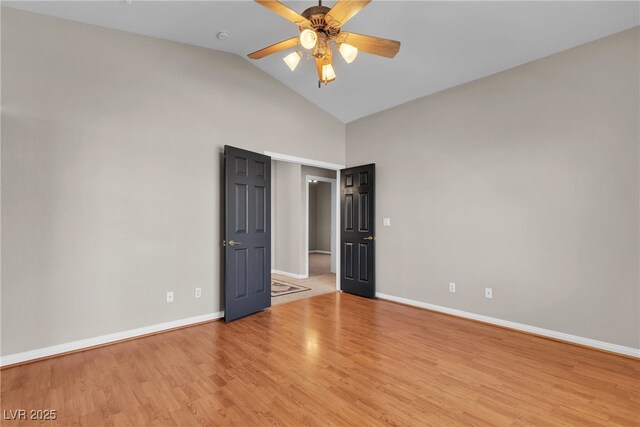 3047 Whispering Crest Dr, Henderson, NV 89052 - unfurnished bedroom with high vaulted ceiling, baseboards, wood finished floors, and a ceiling fan
