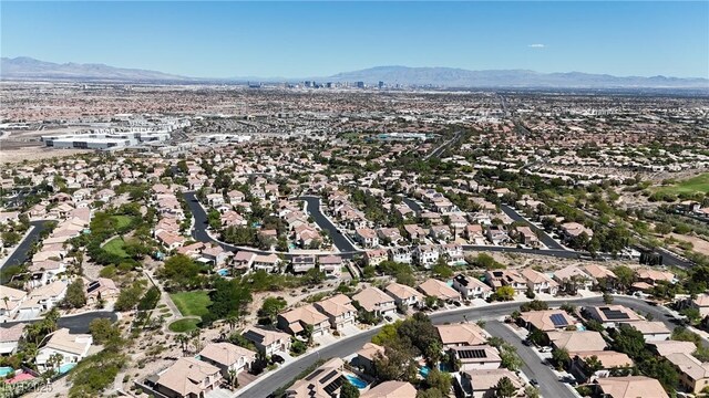3047 Whispering Crest Dr, Henderson, NV 89052 - aerial view of property and surrounding area with a mountain backdrop and nearby suburban area