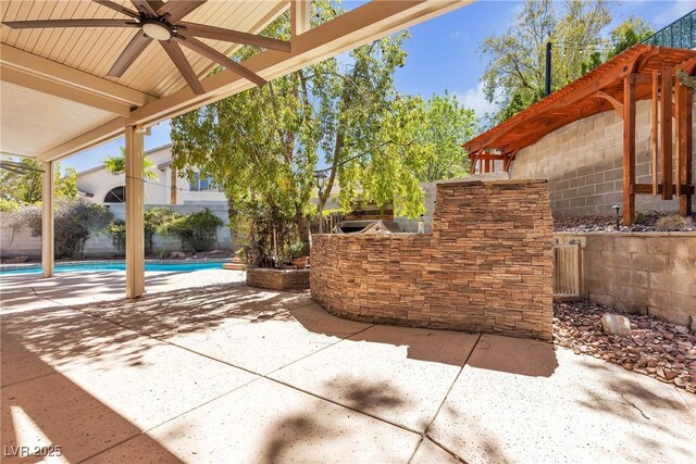 3047 Whispering Crest Dr, Henderson, NV 89052 - fenced backyard featuring a patio and ceiling fan