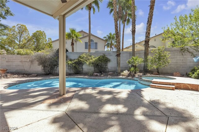 3047 Whispering Crest Dr, Henderson, NV 89052 - view of swimming pool featuring a patio area, a fenced backyard, and a pool with connected hot tub