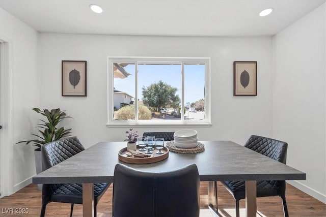 dining area featuring recessed lighting, baseboards, and wood finished floors