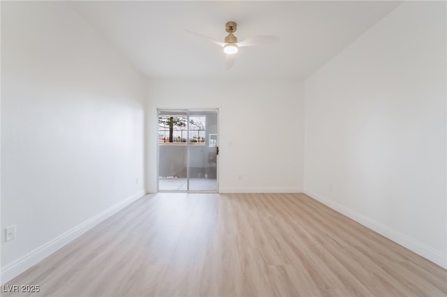 spare room featuring ceiling fan, light wood finished floors, and baseboards