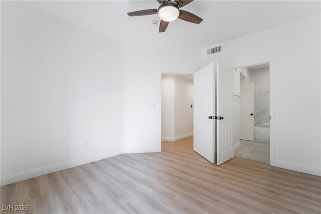 unfurnished bedroom with light wood-style flooring, a ceiling fan, visible vents, and baseboards