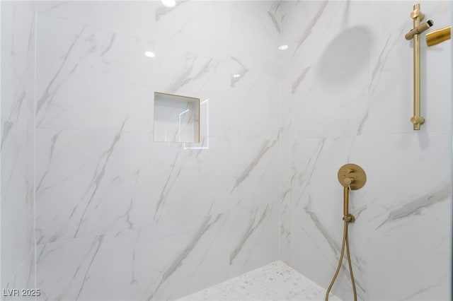 details featuring a marble finish shower