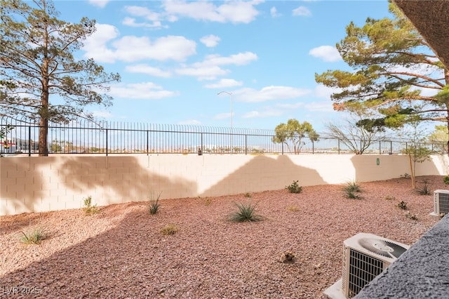 view of yard featuring a fenced backyard and cooling unit