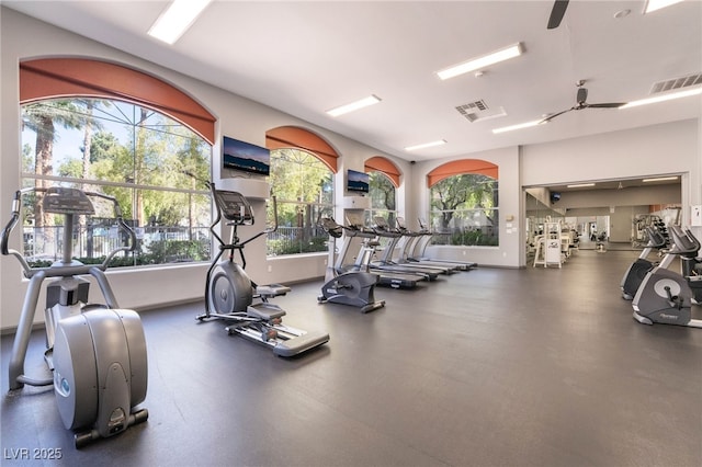 exercise room with visible vents and baseboards