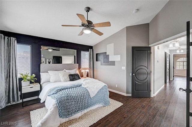 bedroom featuring baseboards, a ceiling fan, lofted ceiling, and wood finished floors