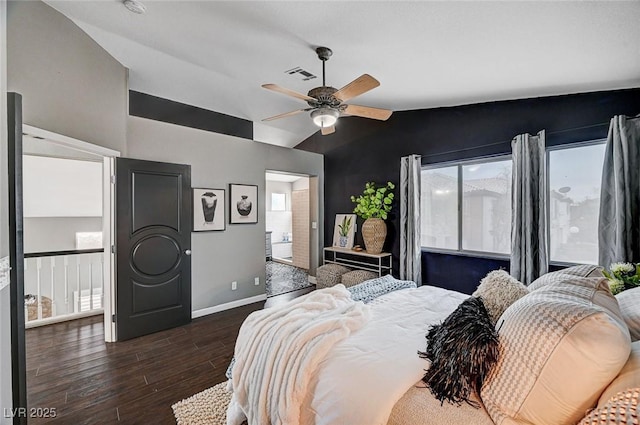 bedroom featuring wood finished floors, visible vents, baseboards, ceiling fan, and vaulted ceiling