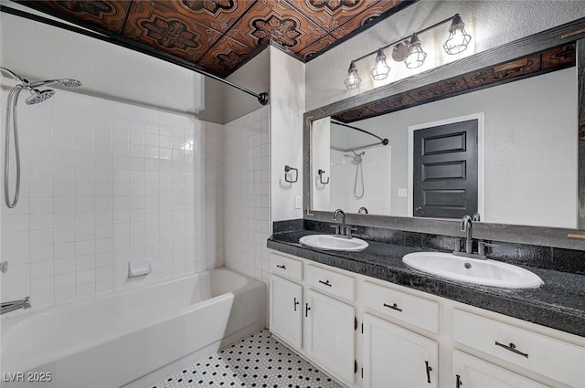 bathroom featuring double vanity, an ornate ceiling, shower / tub combination, and a sink