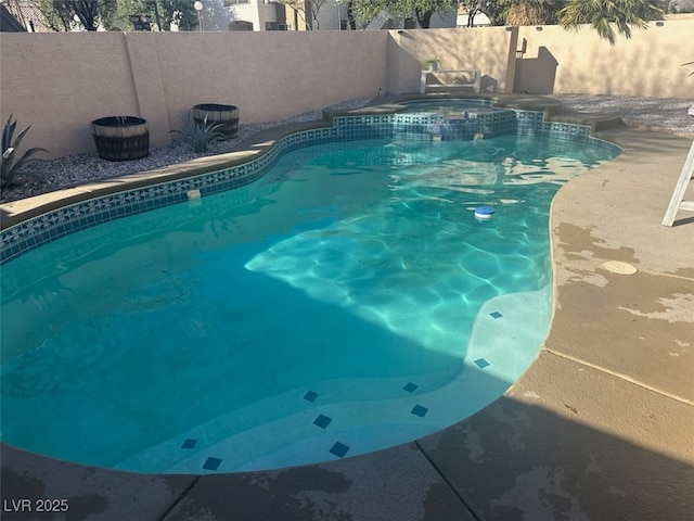 view of swimming pool featuring a fenced in pool and a fenced backyard