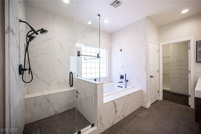 full bathroom featuring a garden tub, recessed lighting, visible vents, a closet, and a marble finish shower