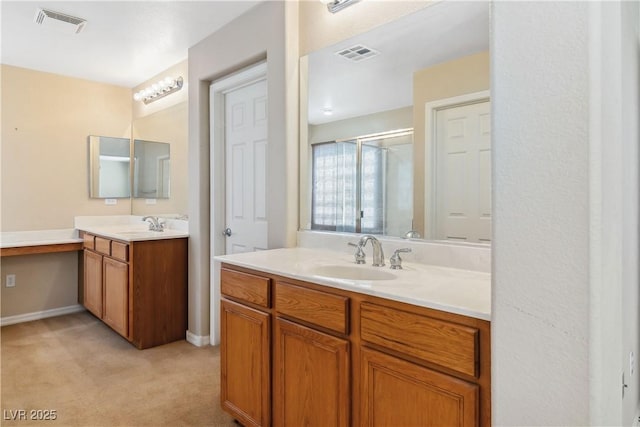 full bathroom with visible vents, two vanities, and a sink