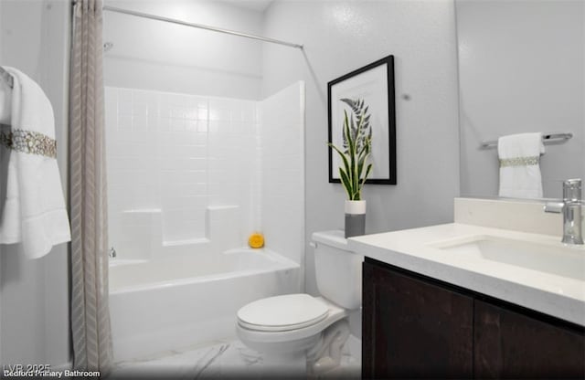 full bath with marble finish floor, shower / bath combo, vanity, and toilet