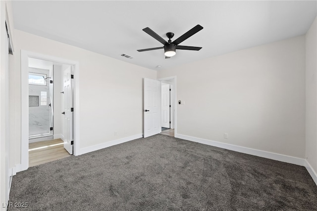 unfurnished bedroom featuring baseboards, visible vents, a ceiling fan, connected bathroom, and carpet flooring