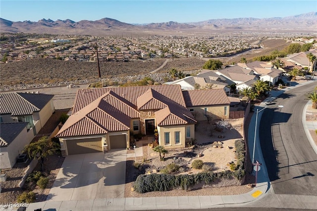 birds eye view of property with a residential view and a mountain view