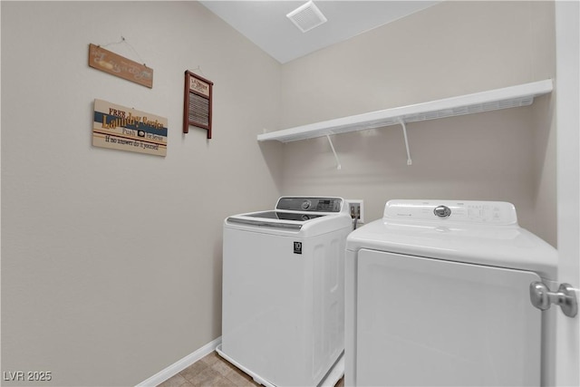 laundry room with laundry area, washing machine and dryer, visible vents, and baseboards