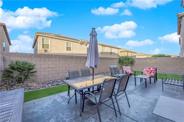 view of patio / terrace featuring a fenced backyard and outdoor dining area