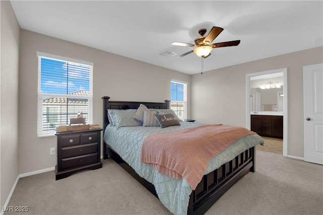 bedroom featuring visible vents, a ceiling fan, light carpet, ensuite bath, and baseboards