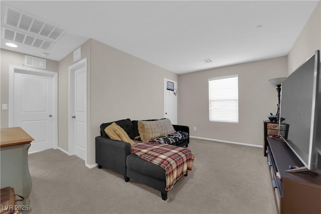 living room featuring baseboards, visible vents, and light colored carpet