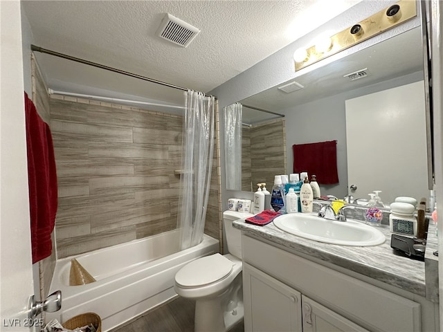 bathroom with visible vents, shower / bath combo with shower curtain, a textured ceiling, and vanity