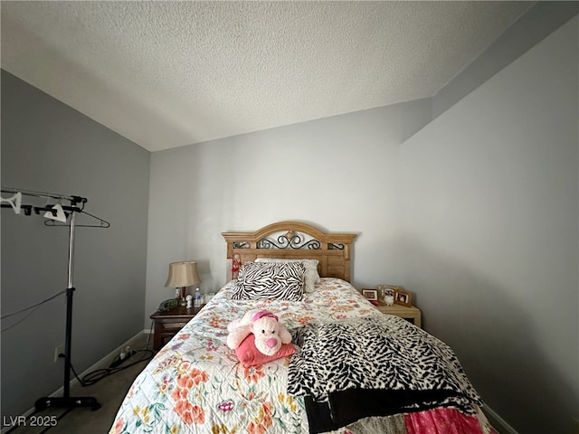 bedroom featuring carpet, vaulted ceiling, a textured ceiling, and baseboards