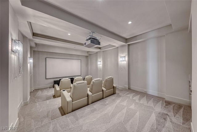 carpeted home theater featuring baseboards, a raised ceiling, and recessed lighting