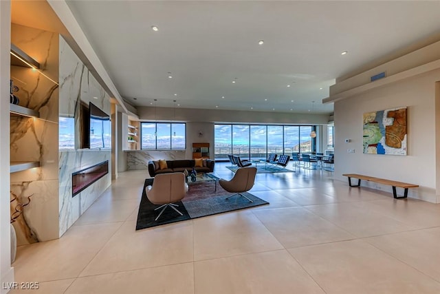 living room with recessed lighting and light tile patterned floors