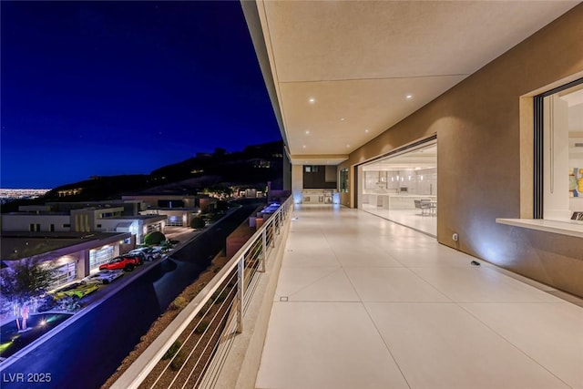 view of balcony at twilight