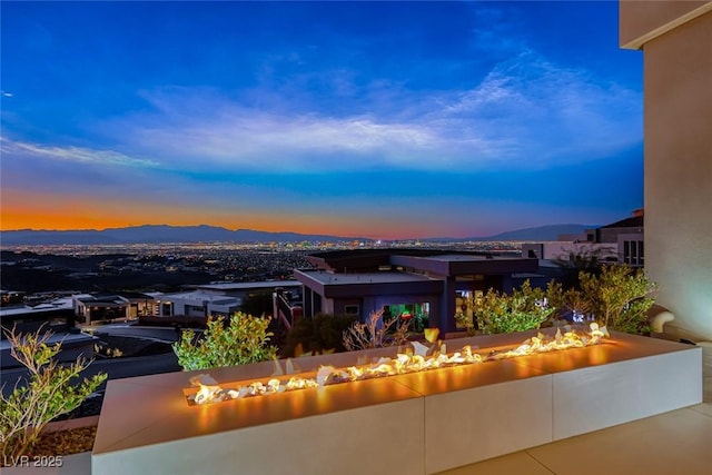 patio terrace at dusk with a mountain view