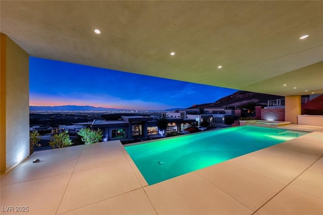 outdoor pool featuring a patio area