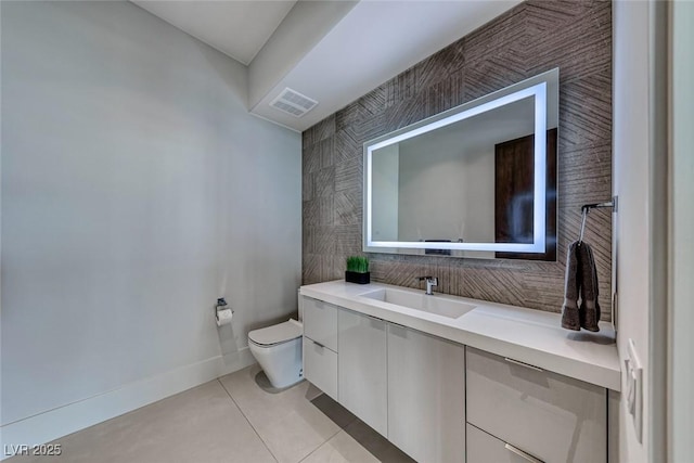 bathroom with tasteful backsplash, visible vents, toilet, vanity, and tile patterned floors