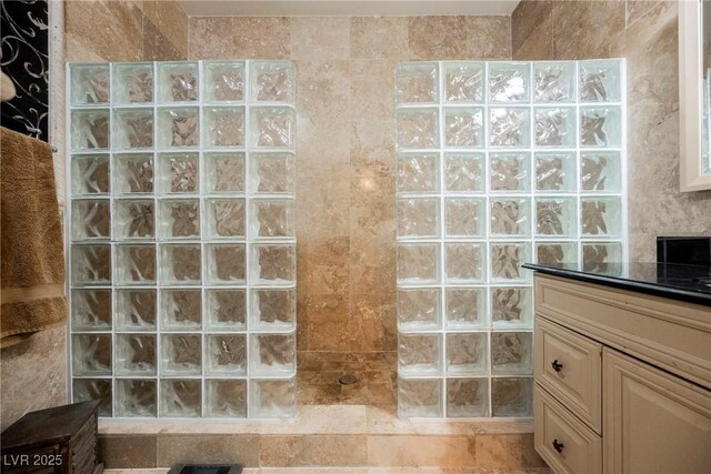 bathroom featuring vanity and walk in shower