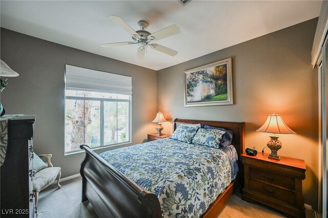 bedroom with carpet flooring, baseboards, and ceiling fan