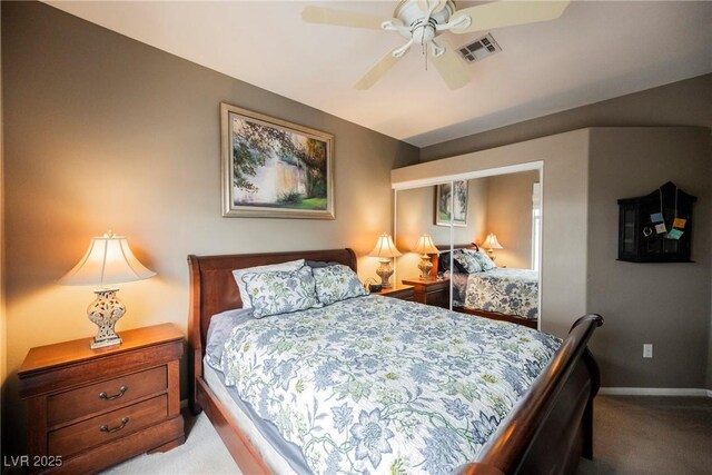 carpeted bedroom with baseboards, visible vents, and ceiling fan