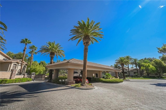 view of building exterior with curved driveway