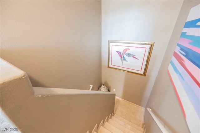 staircase featuring tile patterned floors