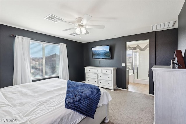 bedroom featuring a ceiling fan, light colored carpet, and visible vents