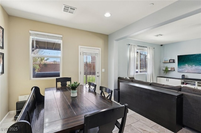 dining room with light tile patterned floors, visible vents, and recessed lighting