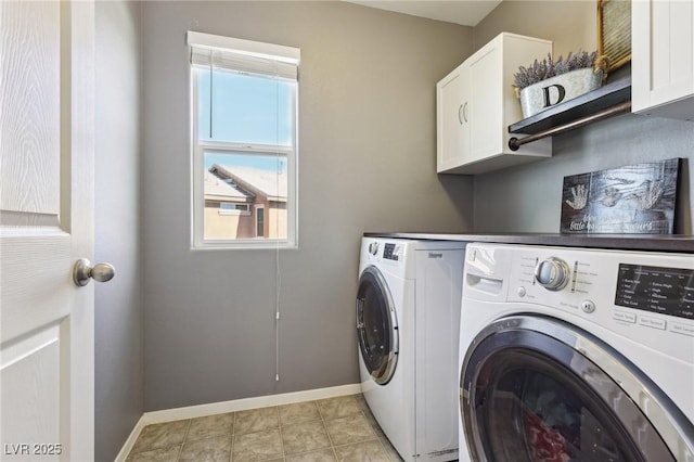 clothes washing area featuring cabinet space, baseboards, and independent washer and dryer