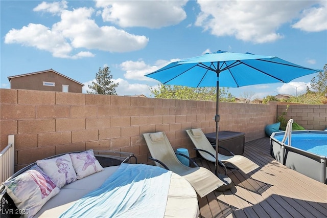 view of patio with a fenced in pool, a fenced backyard, an outdoor living space, and a wooden deck