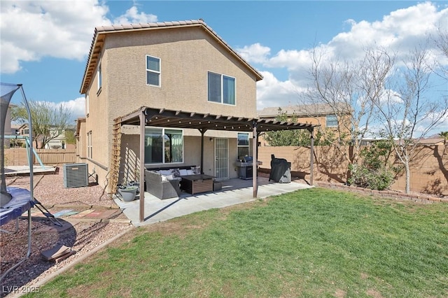 rear view of property with a fenced backyard, an outdoor hangout area, a lawn, a trampoline, and a patio area