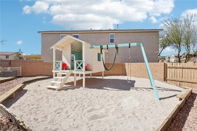 view of playground with a fenced backyard