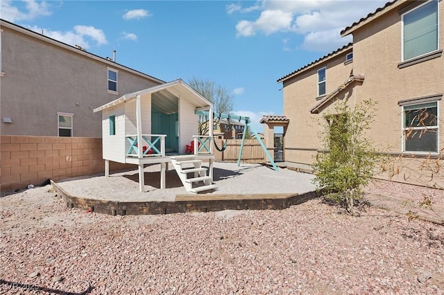 back of house featuring a patio area, fence, and stucco siding