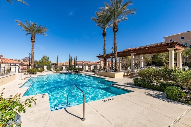 community pool featuring a patio area and a pergola