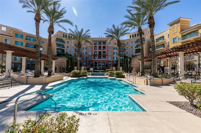 pool featuring a patio area and a pergola