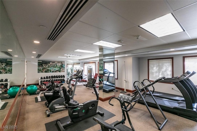 exercise room featuring visible vents and a drop ceiling