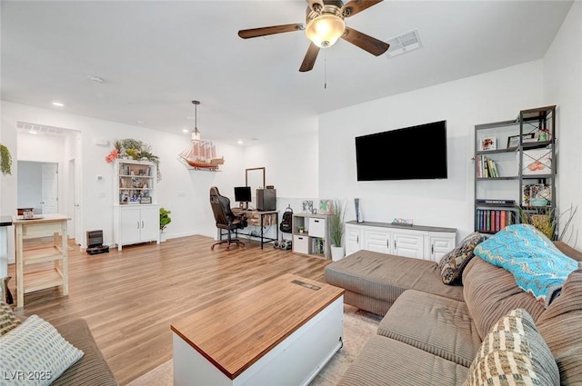 living area featuring light wood-type flooring, visible vents, ceiling fan, and recessed lighting