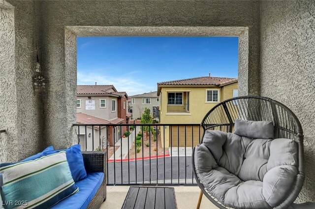 balcony with a residential view and an outdoor living space