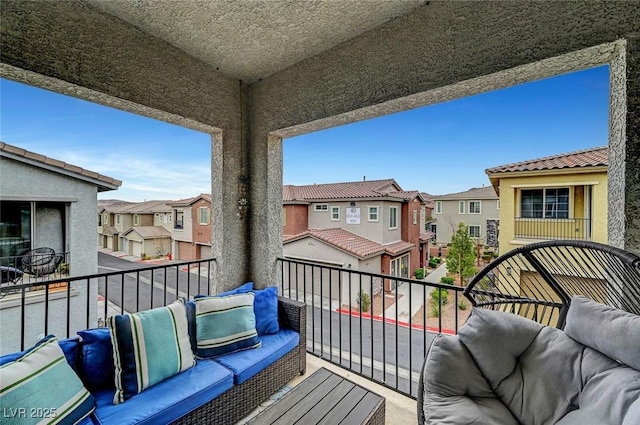 balcony featuring an outdoor hangout area and a residential view